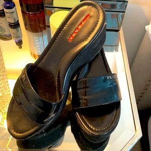 Prada patent slides.